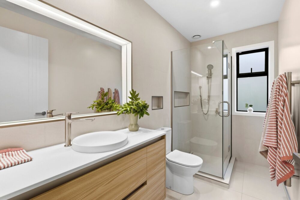 Contemporary ensuite with timber vanity, walk-in shower and modern finishes in a Richmond, Nelson home