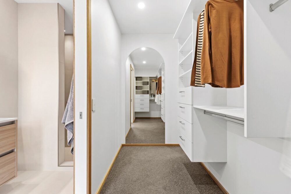 Walk-in robe with built-in storage in a contemporary Richmond, Nelson home