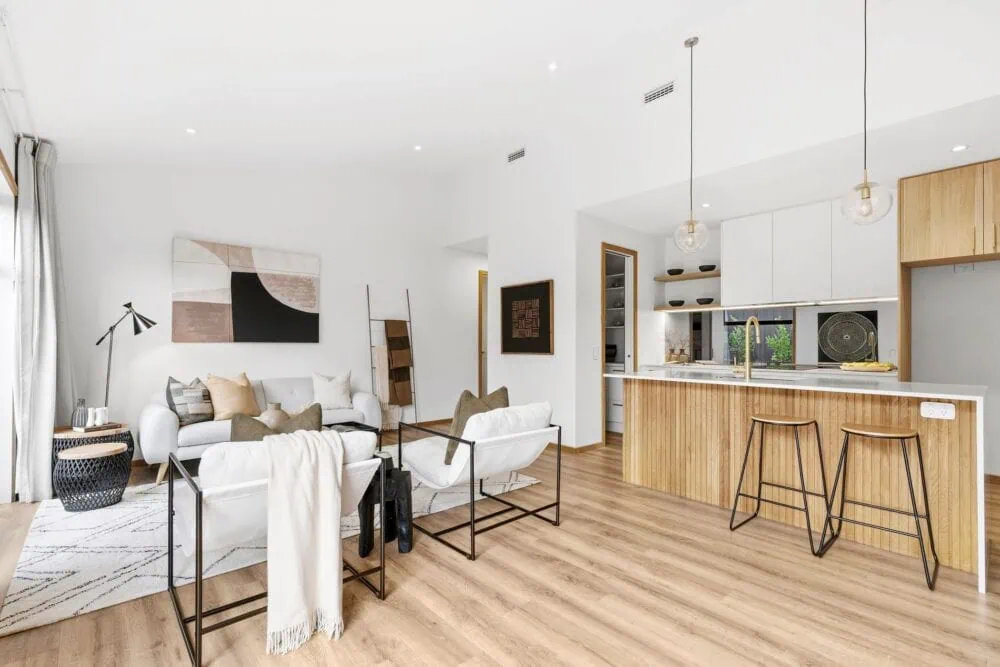 Open-plan living and dining area with timber flooring in a modern Richmond home